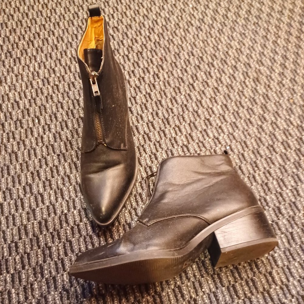 Front zip black leather ankle boots